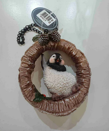 VA Hanging Penguin on Birch Log
